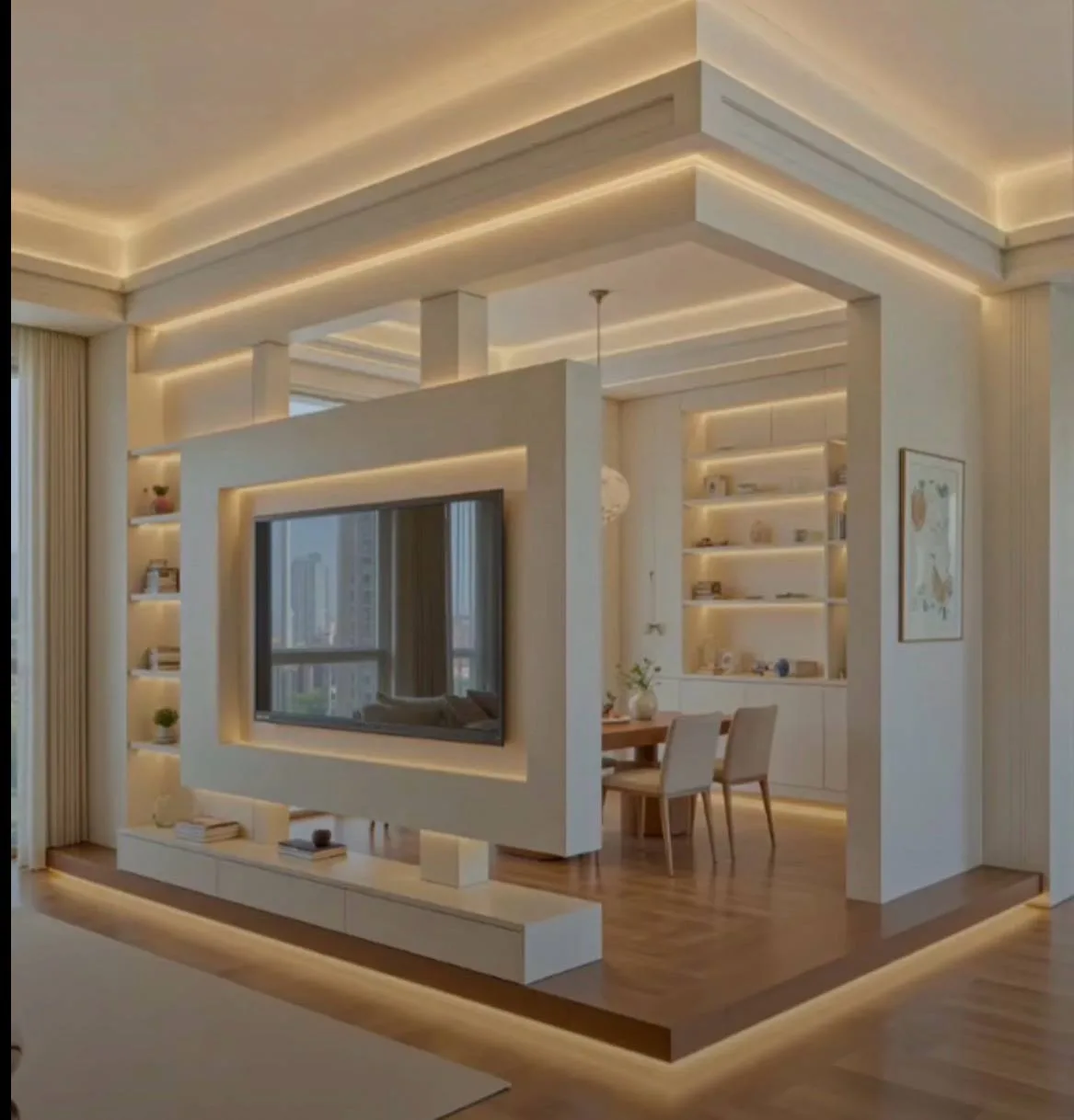 Brick media partition with TV cutout during construction, then finished backlit white media wall and herringbone platform.