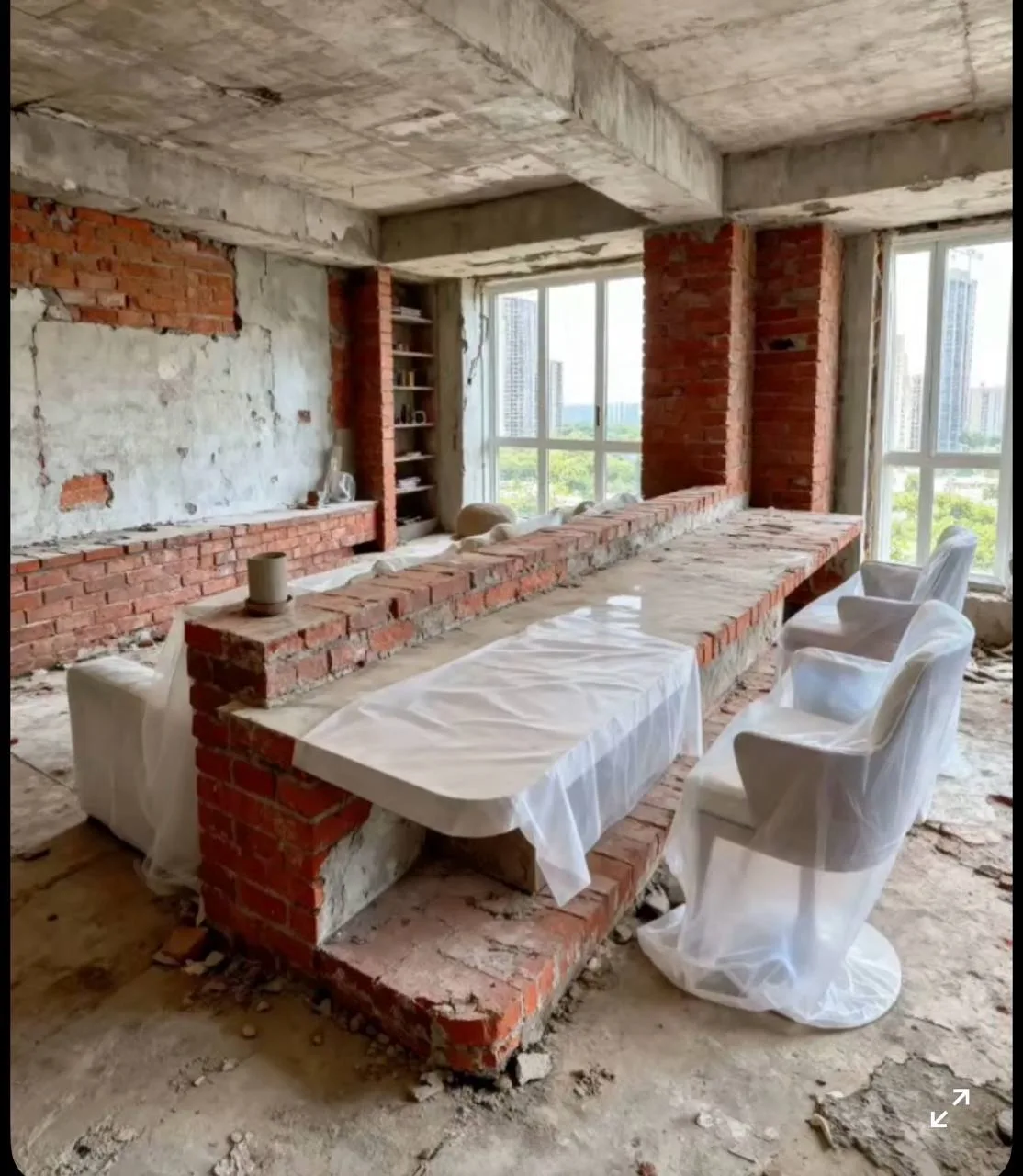 Apartment Interior: Media Partition & Marble Bar — before — Brick bar base under construction with city windows, then finished white marble bar with integrated lighting.