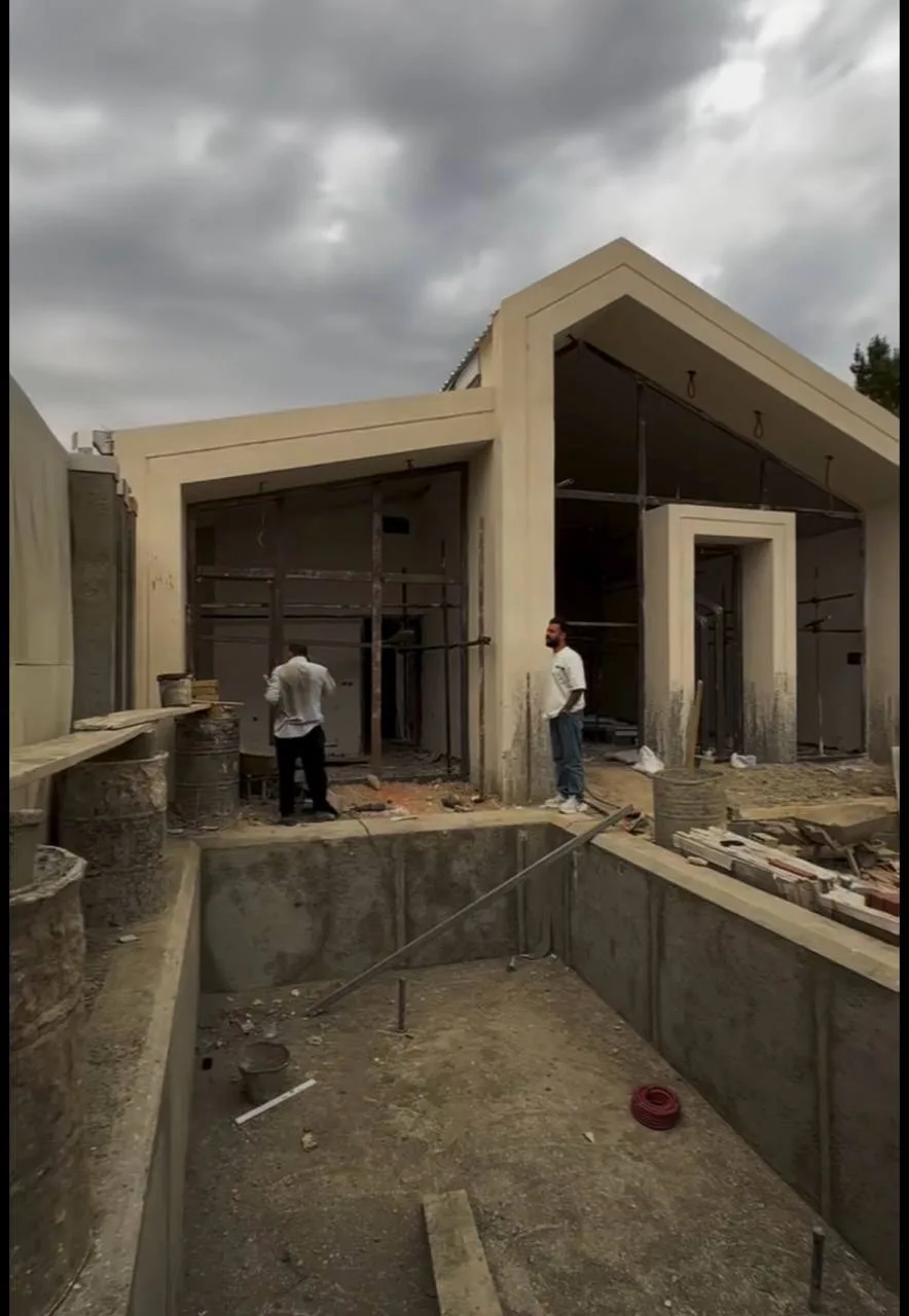 Pool Pavilion: Shell to Night-Lit Finish — before — Pool and pavilion shell under construction, then night-lit finished pool with waterfall and LED roof edge.