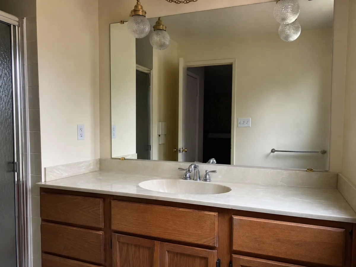 Dated ensuite vanity before renovation, North Vancouver